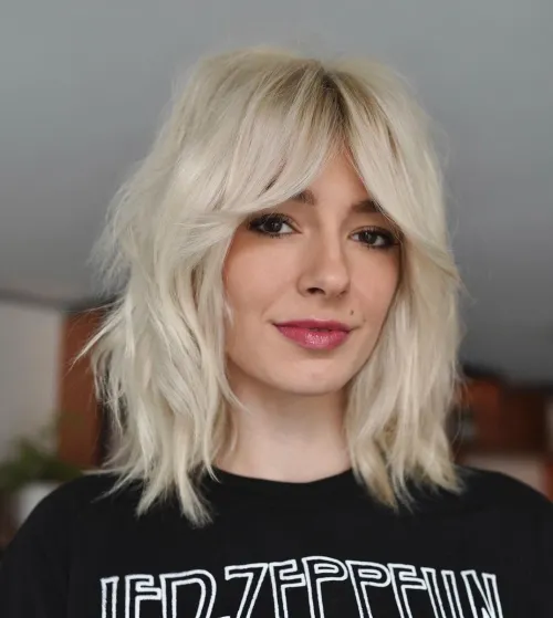 Edgy Blonde Shag with Curtain Bang